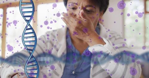 Senior indian woman covering mouth with dna helix and virus particles for genetic health
