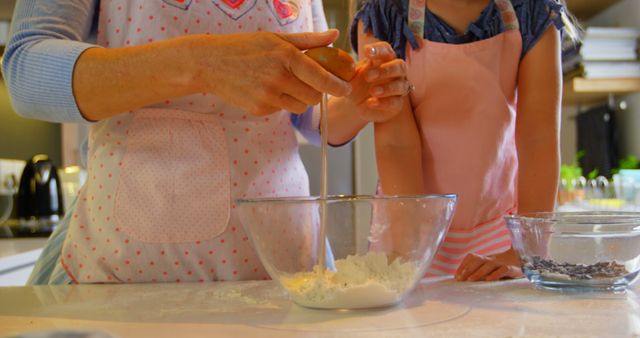Grandparent and grandchild baking cookies together at home. This image can be used for ads, blog posts, social media content that focuses on family bonding, home cooking, and baking activities.