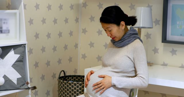 Pregnant Woman at Home Relaxing in Modern Nursery - Download Free Stock Images Pikwizard.com