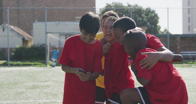 Diverse Kids Celebrating After Soccer Match with Smartphone - Download Free Stock Images Pikwizard.com