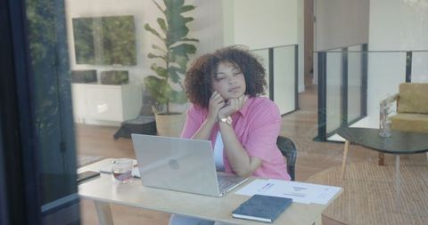 Relaxed African American Woman Reflecting by Home Workplace Window