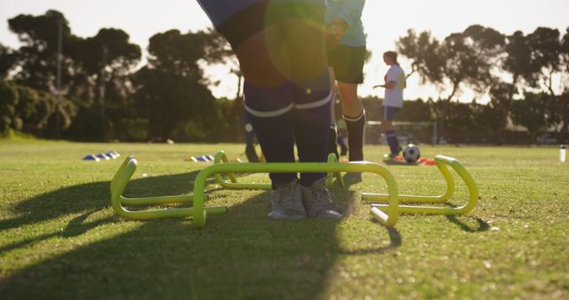 Soccer Players Running Drills On Field At Sunset Training Session - Download Free Stock Images Pikwizard.com