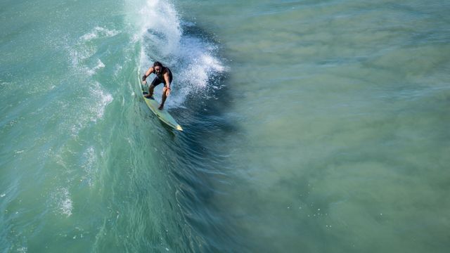 Professional Surfer Riding Ocean Wave - Download Free Stock Photos Pikwizard.com