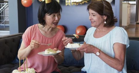 Senior friends enjoying birthday cake celebration lifestyle