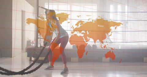 Athletic Woman Exercising with Battle Ropes and World Map Overlay