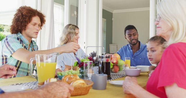 Image of diverse family spending time together and having dinner. Family life, spending time together with family.