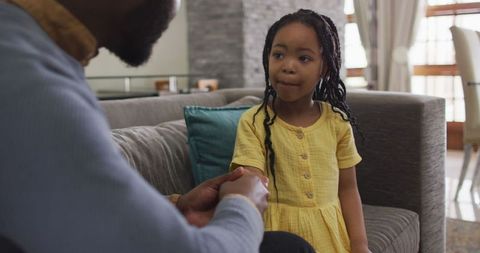Father and Daughter Bonding, Girl Listening Attentively at Home
