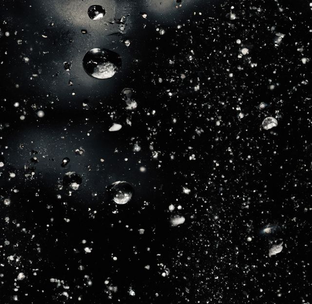 Image of close up of multiple rain drops on glsss surface. Nature, rain, water and weather concept.