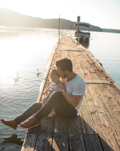 Father and Daughter Sitting on Dock by Lake at Sunset - Download Free Stock Images Pikwizard.com