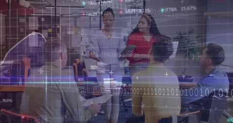 Diverse Business Team Analyzing Data in High-Tech Office