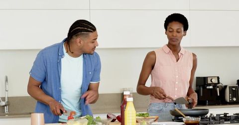 Diverse Couple Preparing Meal in Home Kitchen