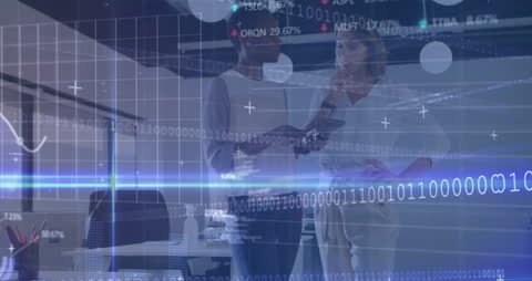 Women Collaborating on Data Analytics in Modern Office Environment