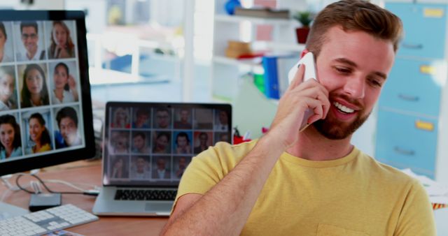 Man Talking on Phone in Modern Office with Virtual Conferencing - Download Free Stock Images Pikwizard.com