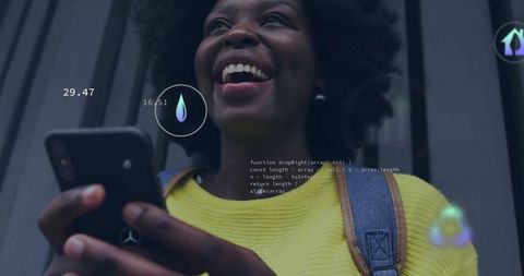 Smiling woman interacting with technology and digital interfaces