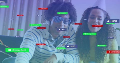 Couple receiving social media likes and messages during cozy livestream at home
