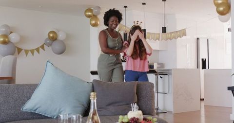 Surprise birthday celebration in modern living room