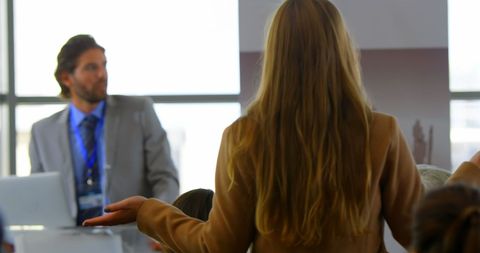 Confident Businesswoman Engaging in Seminar Discussion