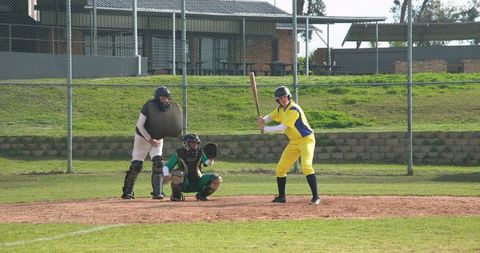 Female baseball player waiting for pitch in game