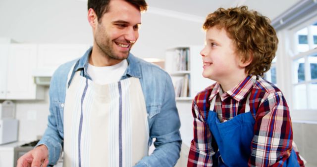 Father and son enjoying quality time baking together in kitchen - Download Free Stock Images Pikwizard.com