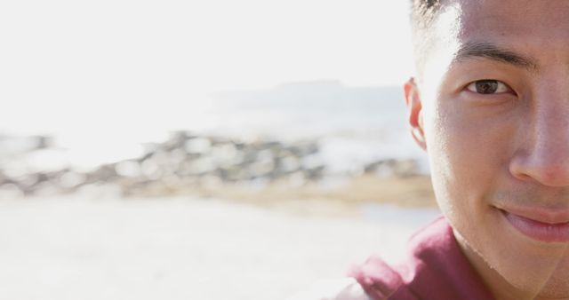 Young Man Smiling Outdoors with Bright Sunlight - Download Free Stock Images Pikwizard.com