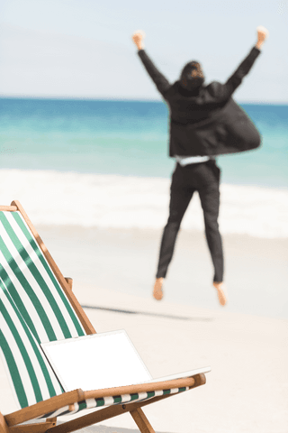 Transparent joyful businessman jumping on relaxing beach day