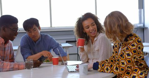 Diverse Team Enjoying Coffee Break in Modern Office