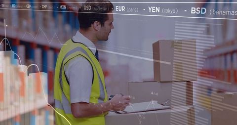 Warehouse worker scanning inventory with analytics overlay for logistics stock control
