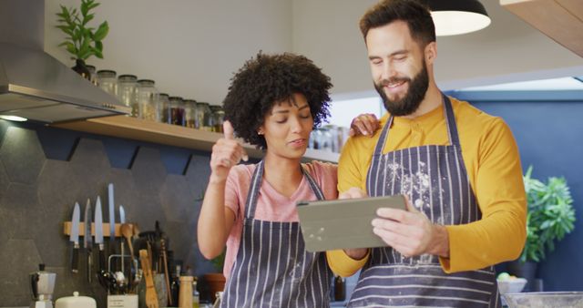 Happy Couple Cooking Together and Using Tablet in Modern Kitchen - Download Free Stock Images Pikwizard.com