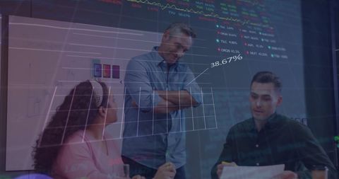 Financial team analyzing data trends in modern office