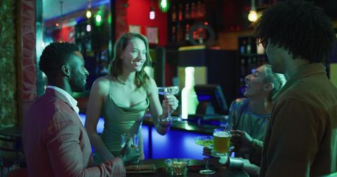 Diverse Friends Toasting and Enjoying Night Out at Bar - Download Free Stock Images Pikwizard.com