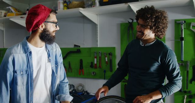 Two Young Men Having Conversation in Workshop with Repairs - Download Free Stock Images Pikwizard.com