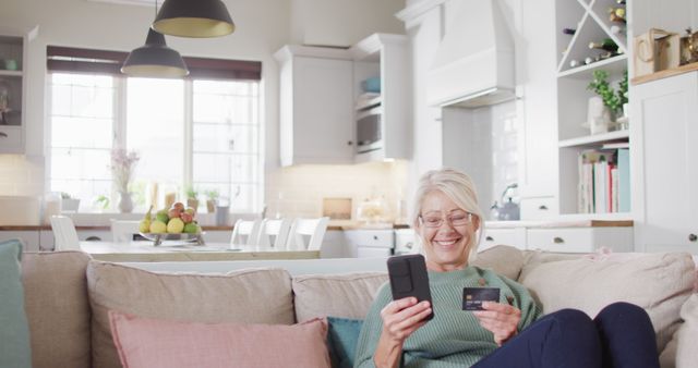 Senior Woman Shopping Online with Credit Card in Modern Kitchen - Download Free Stock Images Pikwizard.com