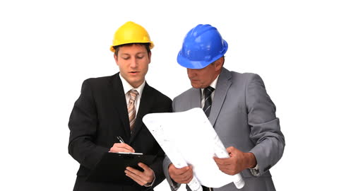 Architects Discussing Building Plans with Helmets