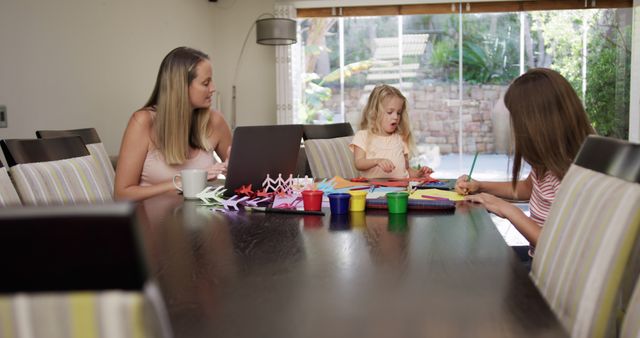 Mother and Two Daughters Engaged in Crafting Activities at Home - Download Free Stock Images Pikwizard.com