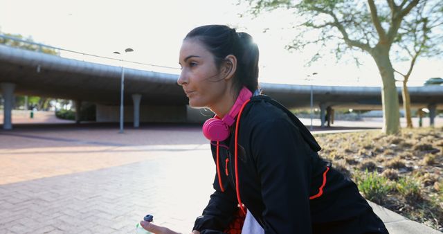 Young Woman Resting After Outdoor Jogging with Headphones - Download Free Stock Images Pikwizard.com