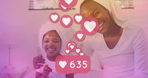 Smiling Mother and Daughter Enjoying Skincare Routine with Social Media Reactions