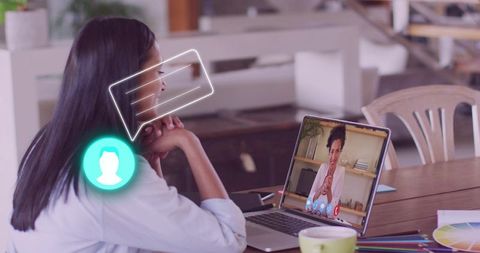 Woman Talking on Video Call in Home Office with Laptop