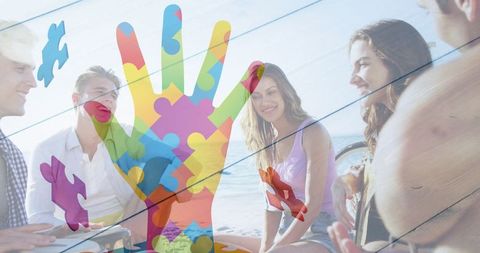 Puzzle Pieces Hand with Friends at Beach Party Celebrating Inclusion