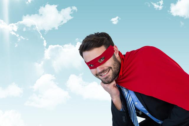 Digital composite of Businessman wearing super hero costume in sky