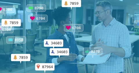 Coworkers Engaging in Discussion with Social Media Notifications Overlay