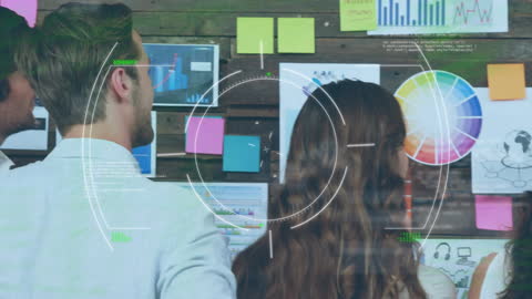 Team Collaborating on Creative Business Project with Data Interfaces