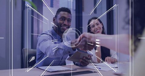 Professional Handshake in Modern Office Setting with Digital Overlay