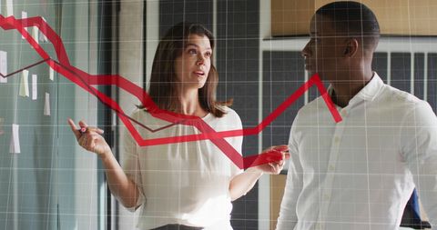 Diverse Colleagues Analyzing Business Graph in Office Setting - Download Free Stock Images Pikwizard.com