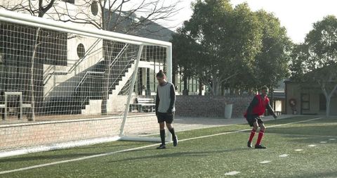 Soccer Goal Scored with Goalkeeper Diving on Outdoor Field