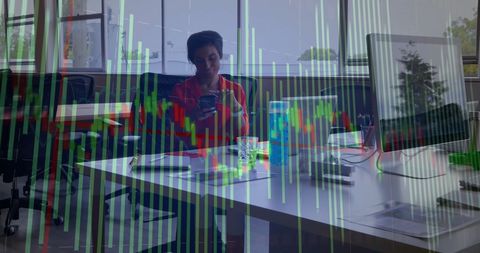 Businesswoman Analyzing Data Charts with Smartphone in Modern Office