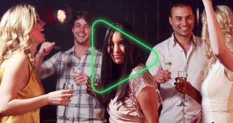 Smiling Friends Celebrating and Dancing Together at Party