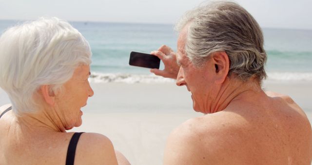 Senior Couple Taking Selfie on Beach Relaxing by Ocean - Download Free Stock Images Pikwizard.com