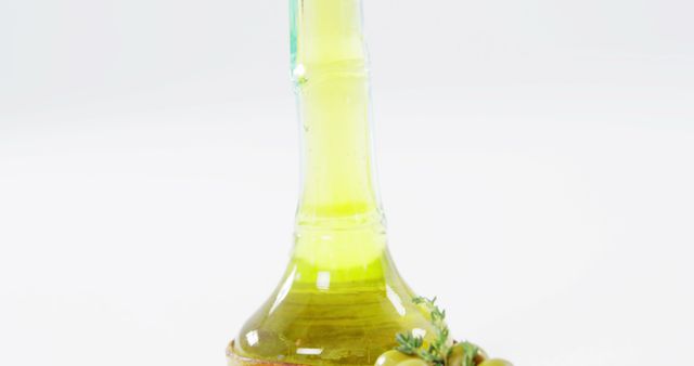 Olive Oil Bottle with Fresh Olives and Herb Garnish on Light Background - Download Free Stock Images Pikwizard.com