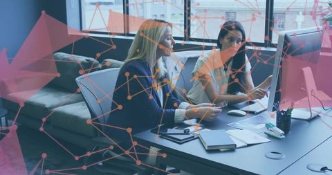 Two Professional Women Collaborating on Data Analytics and Strategy at Office with Network Overlay