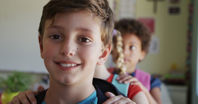 Smiling Boy in Classroom with Classmates Preparing for School - Download Free Stock Images Pikwizard.com